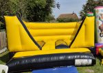 Construction theme black and yellow boys bouncy castle colchester