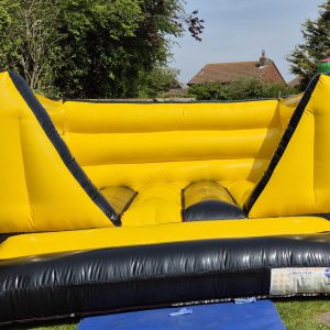 Construction theme black and yellow boys bouncy castle colchester