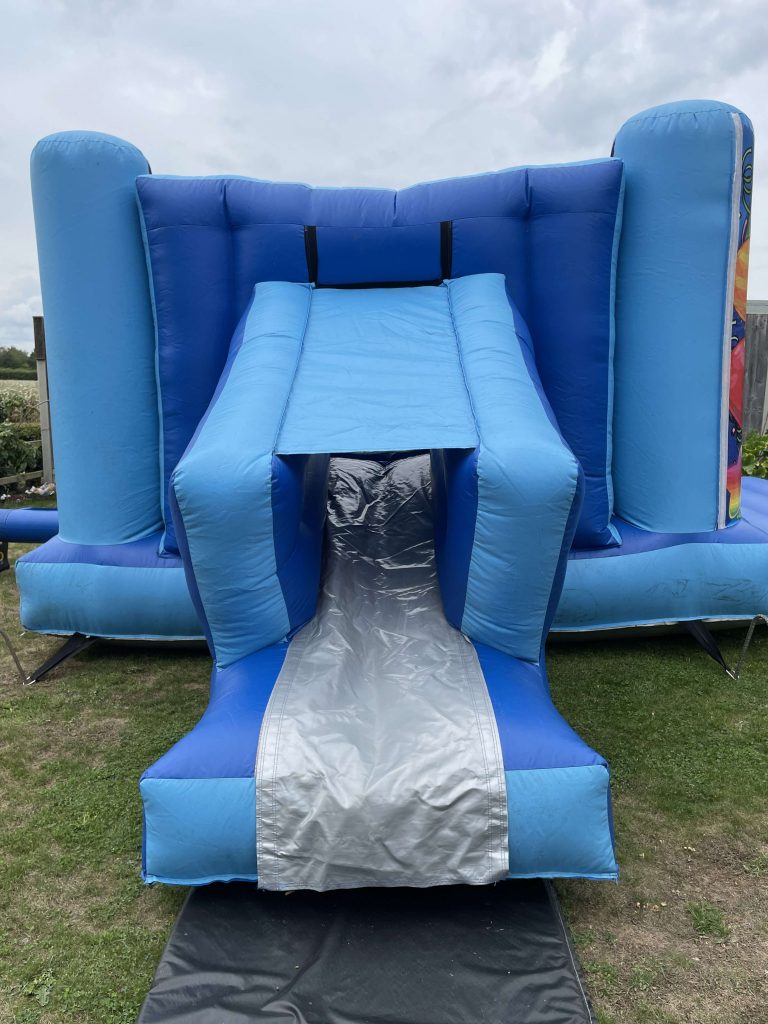 Large Blue Bouncy Castle With A Slide Colchester