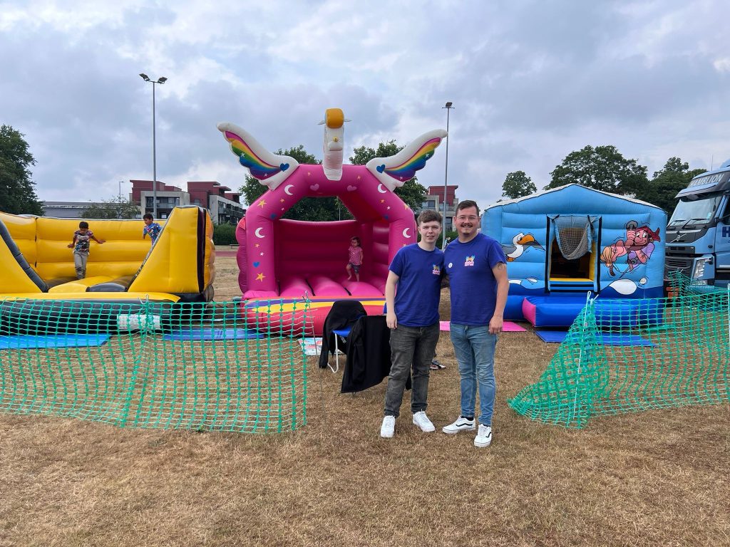 GabSav's team with bouncy castles at an outdoor community event