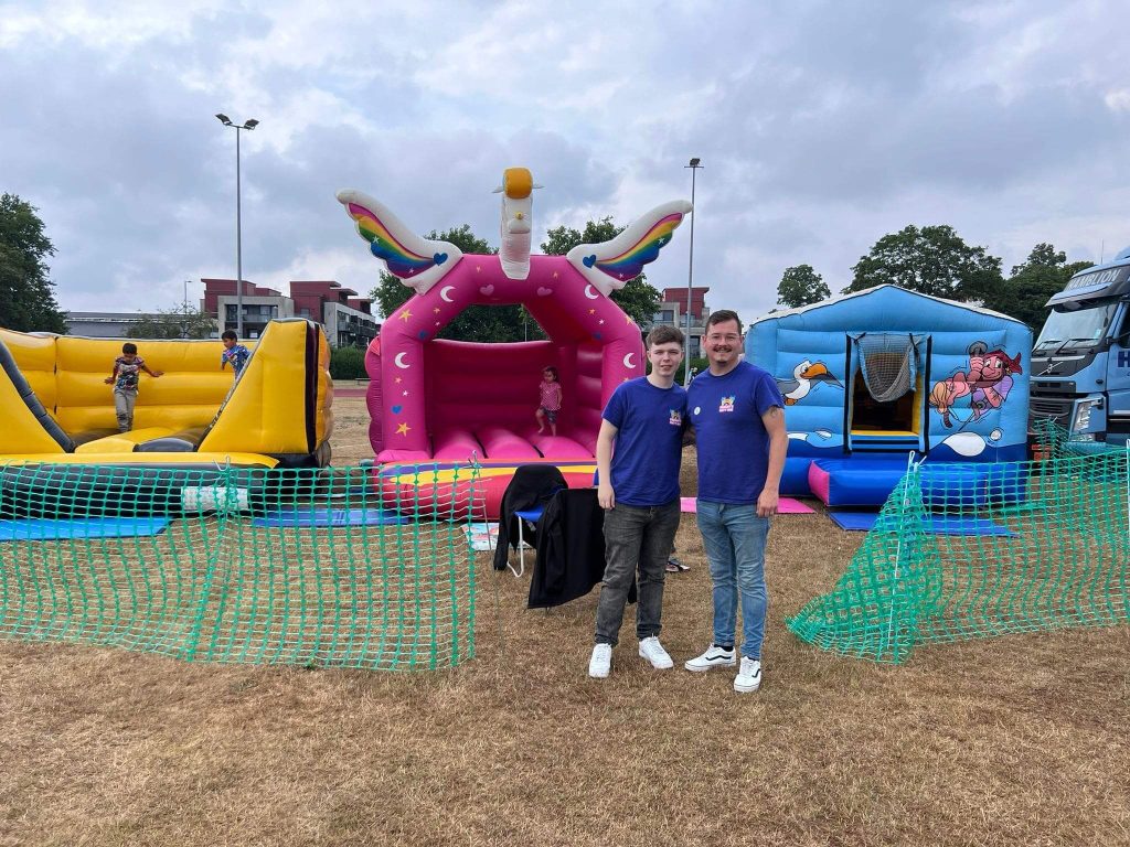 GabSav's team with bouncy castles at an outdoor community event